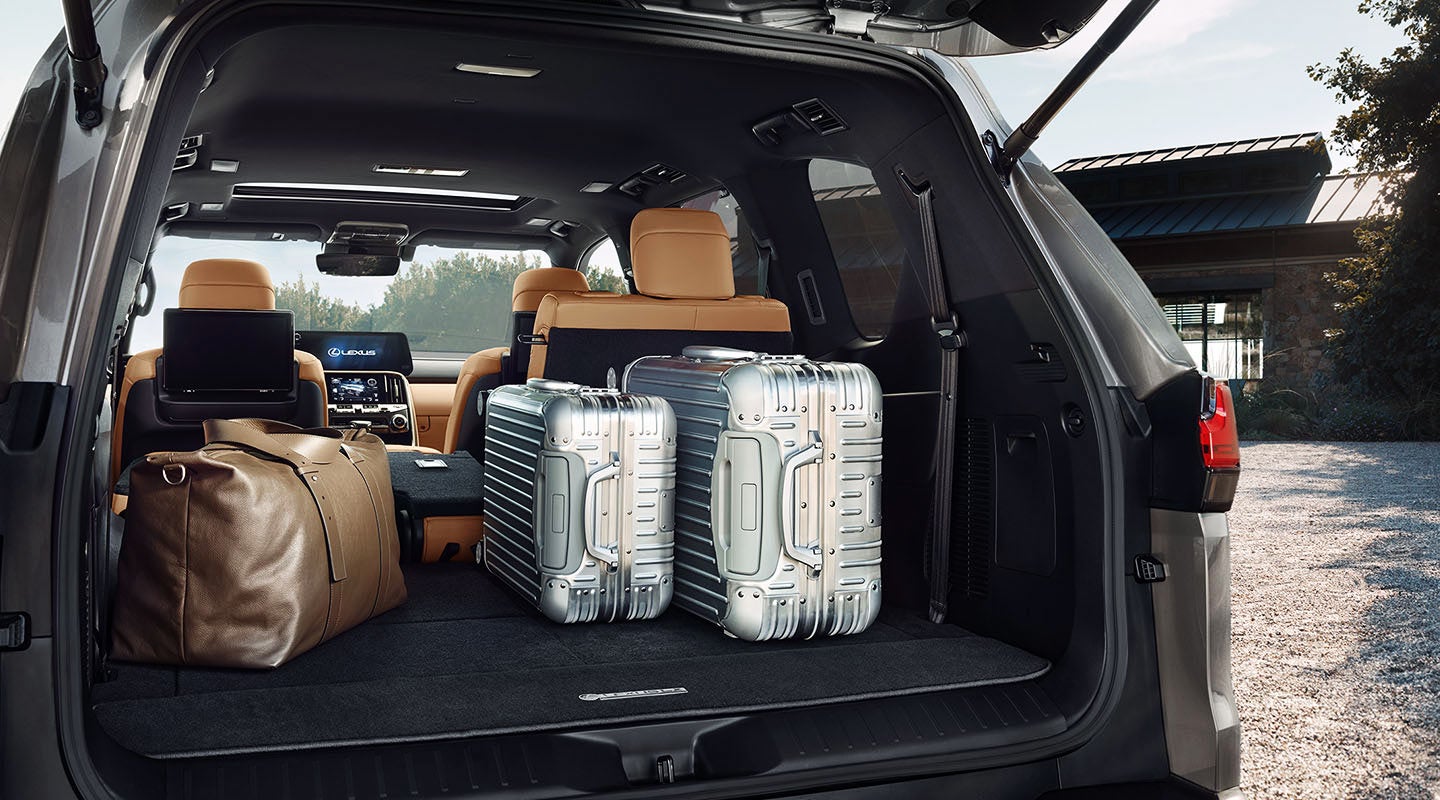 Detail shot of the open trunk of the 2022 Lexus LX 600 with luggage. | Lexus of Akron Canton in Akron OH